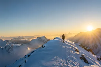 Mountain Climber at Sunrise in Strength