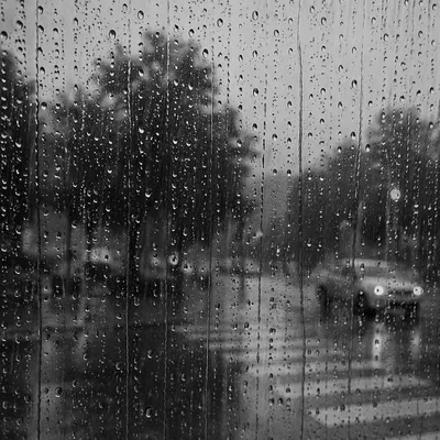 Rain Drops on Blurred City Window