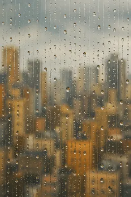 Rain Drops on Blurred City Window