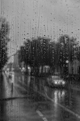 Rainy Window Over Blurred City Street