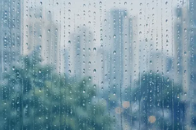 Rain Drops on Blurred City Window