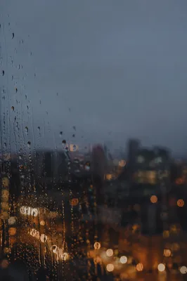 Rainy Window with Blurred City Lights