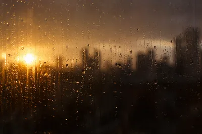 Rain Drops on Window Over Blurred City