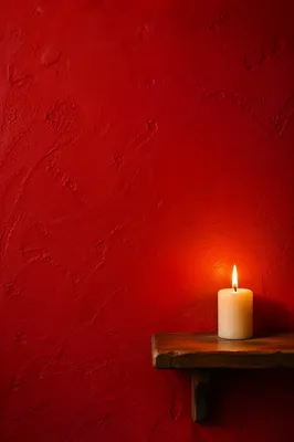 Vibrant Red Prayer Corner with Candle