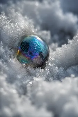 Iridescent Glass Sphere in Snow Crystals