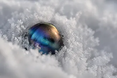 Iridescent Glass Sphere in Snow Crystals