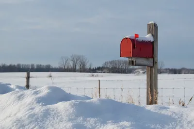 Red Mailbox in Snowy Rural Winter