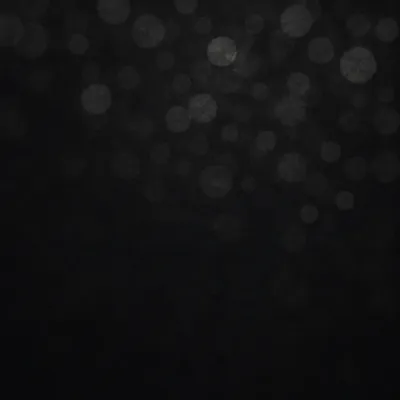 Soft Silver Bokeh on Dark Background