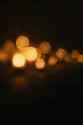 Warm Golden Bokeh Lights in Darkness