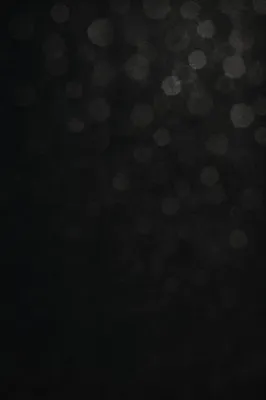 Soft Silver Bokeh on Dark Background