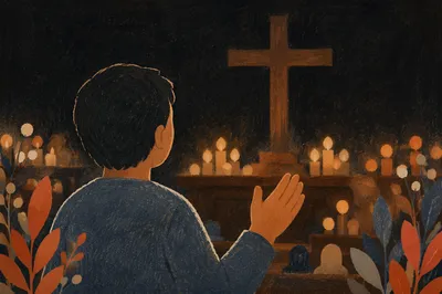 Silhouetted Figure Facing Cross and Candlelight
