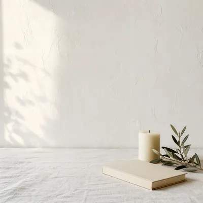 Minimal White Tabletop with Candle and Book