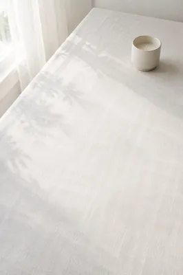 Minimal White Linen Tabletop With Candle