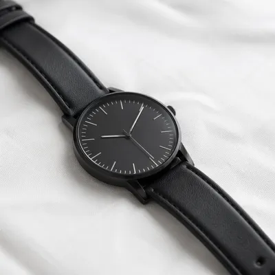Minimal Black Wristwatch on White Background