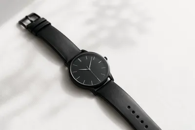 Minimal Black Wristwatch on White Background
