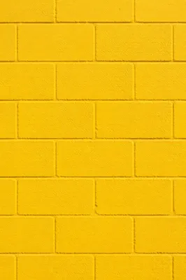 Bright Yellow Painted Concrete Wall Background