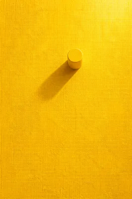 Bright Yellow Textured Background with Shadow