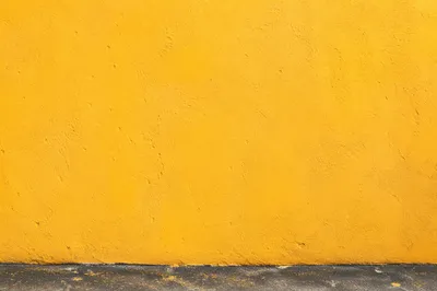 Bright Yellow Stucco Wall Background