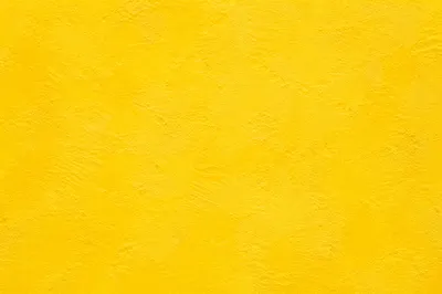 Bright Yellow Textured Plaster Background