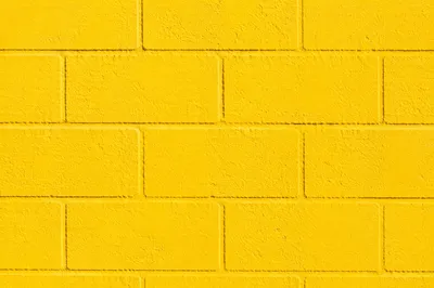 Bright Cheerful Yellow Concrete Wall Background