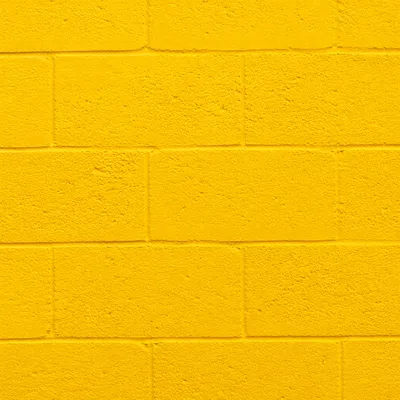 Bright Yellow Painted Concrete Wall Background