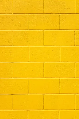 Bright Yellow Painted Concrete Wall Background