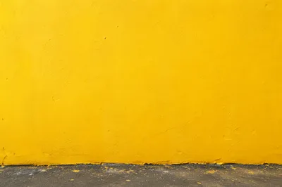 Bright Yellow Stucco Wall Background