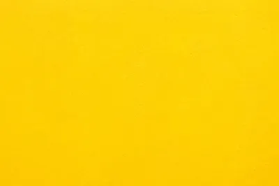 Bright Cheerful Yellow Plaster Background