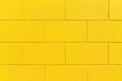 Bright Yellow Painted Concrete Wall Background