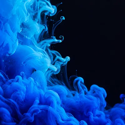 Blue Ink Swirls on Dark Background