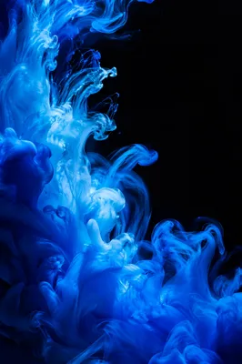 Blue Ink Swirls on Dark Background