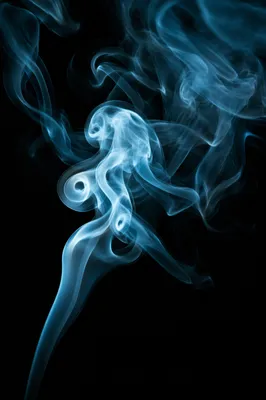 Cyan Smoke Wisps on Black Background