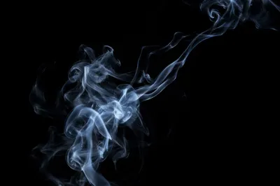 Pale Smoke Wisps on Black Background