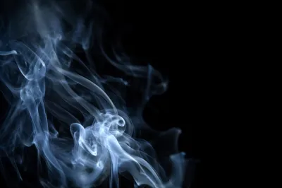 Elegant Blue Smoke Wisps on Black