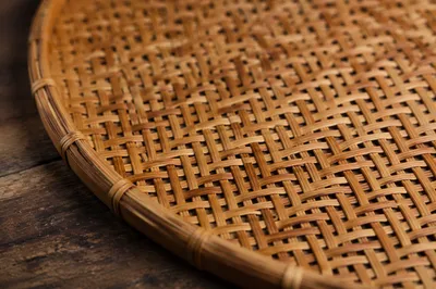 Woven Bamboo Mat on Rustic Wood