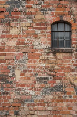 Rustic Red Brick Wall With Arched Window