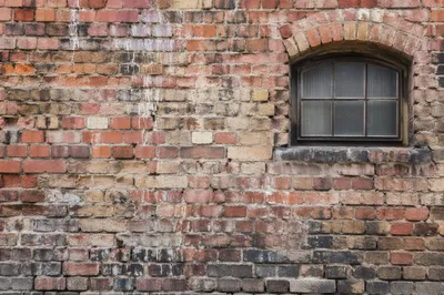Rustic Red Brick Wall With Arched Window