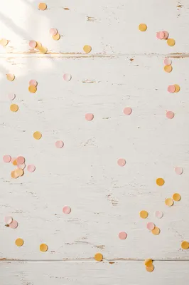 Pastel Confetti on White Wooden Background
