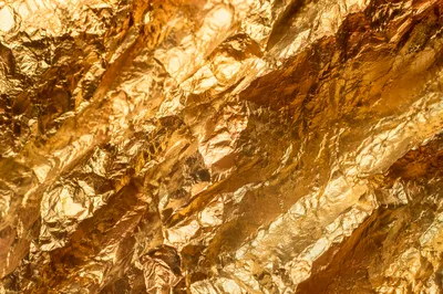 Luxurious Crinkled Gold Foil Texture Background