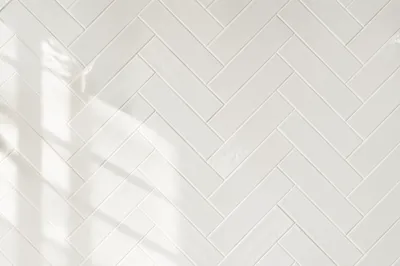Clean White Herringbone Tile Background