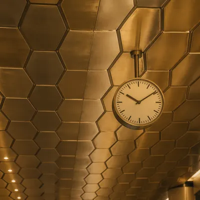 Golden Hexagonal Ceiling With Modern Clock