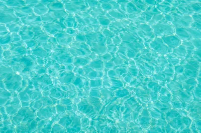 Turquoise Ocean Ripple Texture Overhead Background