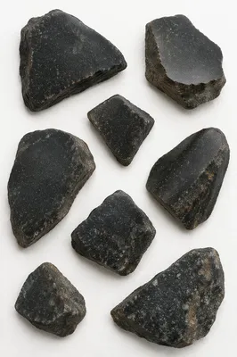 Polished Dark Granite Fragments on White