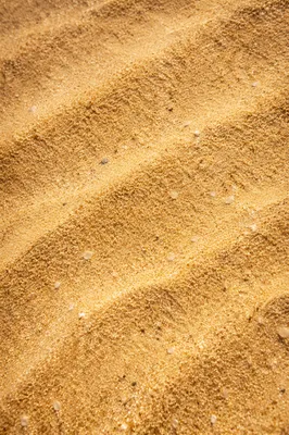 Warm Golden Beach Sand Texture Background