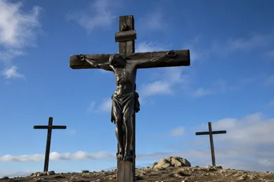 Three Crosses on Golgotha Under Blue Sky