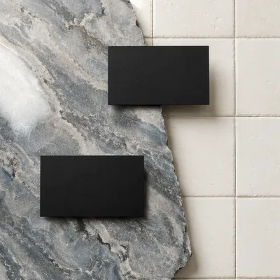 Minimal Black Business Cards on Marble Tiles