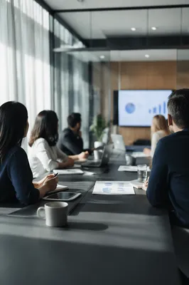 Modern Team Meeting in Glass Conference Room
