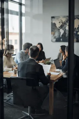 Modern Team Meeting Through Glass Partition