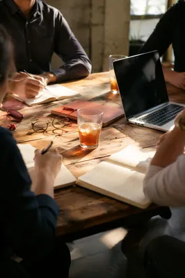 Warm Collaborative Meeting at Wooden Conference Table
