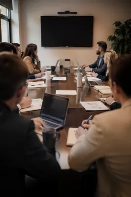 Modern Team Meeting at Conference Table